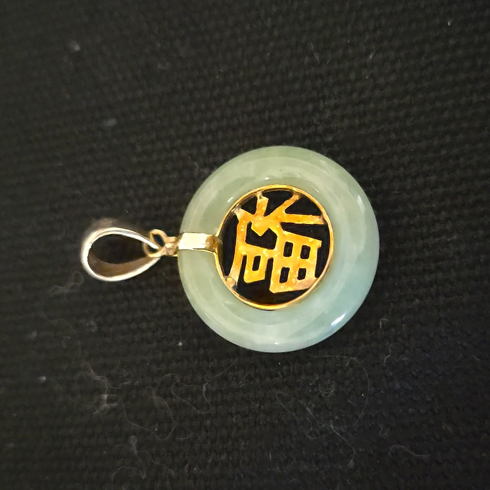 14k jade circle pendant, the Fu symbol represents blessings.